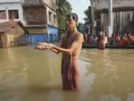 Arup Bera – a resident of Ward 2 of the Ghatal municipality area – was seen traversing the flooded streets near his home to offer ‘tarpan’ on Mahalaya 