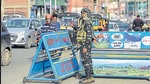 A member of security forces stands guard at a checkpoint in Srinagar, Jammu and Kashmir, on Monday. (PTI)