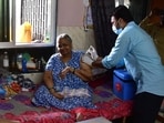 A healthcare worker administers a dose of Covid-19 vaccine to a beneficiary during door-to-door vaccination drive in Mumbai.(Bhushan Koyande/HT File Photo)