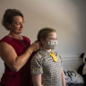 Vaccinations and masks may influence how long a student will have to isolate 