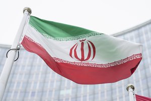 In this Monday, May 24, 2021 file photo, the flag of Iran waves in front of the the International Center building with the headquarters of the International Atomic Energy Agency, IAEA, in Vienna, Austria, Monday, May 24, 2021.