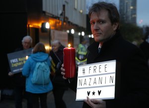 In this Monday, Jan. 16, 2017 file photo, Richard Ratcliffe husband of imprisoned charity worker Nazanin Zaghari-Ratcliffe, poses for the media during an Amnesty International led vigil outside the Iranian Embassy in London