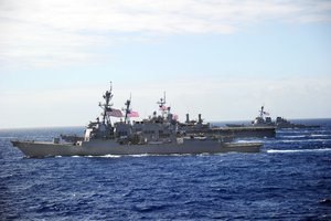 The Arleigh Burke-class guised-missile destroyers USS Chafee (DDG 90) and USS Hopper (DDG 70) are underway in formation with other U.S. Navy ships during Rim of the Pacific (RIMPAC) 2010.