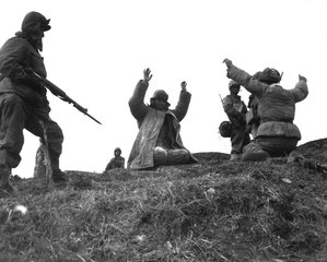 Men of the 1st Marine Division capture Chinese Communists during fighting on the central Korean front. Hoengsong, March 2, 1951.