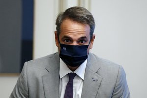 Greece's Prime Minister Kyriakos Mitsotakis attends a meeting with Austria's Interior Minister Karl Nehammer at Maximos Mansion in Athens, Tuesday, Aug. 25, 2020.