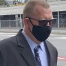 Suspended Queensland police senior constable Robert William Eickenloff leaves Brisbane Arrests Court on Monday.