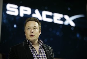 In this May 29, 2014, file photo, Elon Musk, CEO and CTO of SpaceX, introduces the SpaceX Dragon V2 spaceship at the SpaceX headquarters in Hawthorne, California.