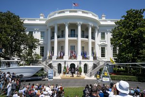 President Donald J. Trump signs an Executive Order on the South Lawn of the White House, Monday, July 15, 2019, at the Made in America Product Showcase.