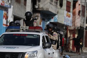 Police patrol near the National Palace after dispersing protestors calling for the resignation of Haitian President Jovenel Moise in Port-au-Prince, Haiti, Tuesday, Oct. 1, 2019