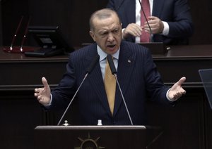 File - Turkey's President Recep Tayyip Erdogan addresses his ruling party lawmakers at the parliament, in Ankara, Turkey, Wednesday, Oct. 28, 2020.