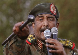 FILE - In this June 29, 2019 file photo, Sudanese Gen. Abdel-Fattah Burhan, head of the military council, speaks during a military-backed rally, in Omdurman district, west of Khartoum, Sudan.