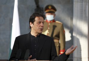 Pakistan Prime Minister Imran Khan speaks during a joint news conference with Afghan President Ashraf Ghani at the Presidential Palace in Kabul, Afghanistan, Thursday, Nov. 19, 2020