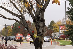 Police close off a street outside a shopping mall after a shooting in Boise, Idaho on Monday, Oct. 25, 2021