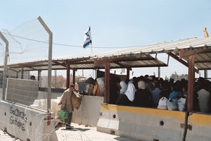 File - Palestinian women queue up at an Israeli checkpoint in the West Bank, just outside the Palestinian city of Ramallah. Kalandia checkpoint between Jerusalem and Ramallah is known as a flash point between Palestinian protesters and Israeli security forces.