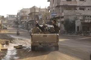 Syrian rebel drive toward the government positions near the village of Nerab, in Idlib province, Thursday, Feb. 6, 2020