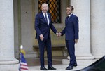 U.S. President Joe Biden, left, and French President Emmanuel Macron speak prior to a meeting at La Villa Bonaparte in Rome, Friday, Oct. 29, 2021.