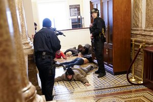 In this Jan. 6, 2021, file photo, U.S. Capitol Police hold rioters at gun-point near the House Chamber inside the U.S. Capitol in Washington.