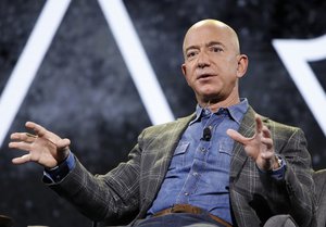 FILE - In this June 6, 2019 file photo, Amazon CEO Jeff Bezos speaks at the the Amazon re:MARS convention, in Las Vegas. Bezos will be aboard for Blue Origin's first human space flight next month.