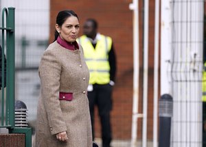 Home Secretary Priti Patel arrives for a regional cabinet meeting at Rolls Royce in Bristol, England, Friday Oct. 15, 2021.