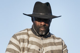 Filmmaker Jeymes Samuel, left, with actor Idris Elba on the set of The Harder They Fall. 