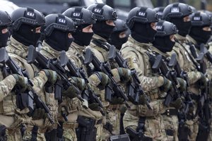 Members of the police forces of Bosnia's Serb-run part stand in formation during exercises on the Jahorina Mountain, Bosnia and Herzegovina, Friday, Oct. 22, 2021.