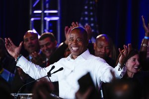 New York City Mayor-elect Eric Adams smiles at supporters, late Tuesday, Nov. 2, 2021, in New York