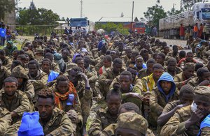 FILE - Captured Ethiopian government soldiers and allied militia members sit in rows after being paraded by Tigray forces through the streets in open-top trucks, as they arrived to be taken to a detention center in Mekele, the capital of the Tigray region of northern Ethiopia on Oct. 22, 2021.