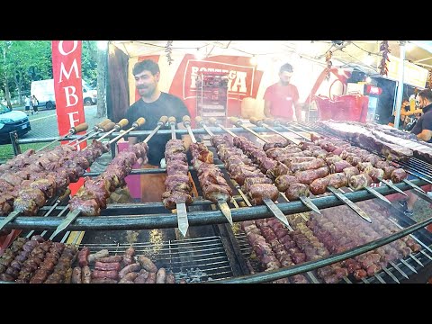 Huge Swords of Pork Meat with Cheese, Ribs, Sausages. Italy Street Food