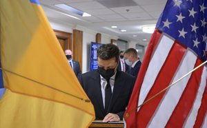 Ukraine President Volodymr Zelenskyy signs the guest book during a bilateral exchange with Secretary of Defense Lloyd J. Austin III at the Pentagon, Washington, D.C., Aug. 31, 2021.