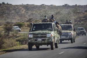 In this Saturday, May 8, 2021 file photo, Ethiopian government soldiers ride in the back of trucks on a road near Agula, north of Mekele, in the Tigray region of northern Ethiopia