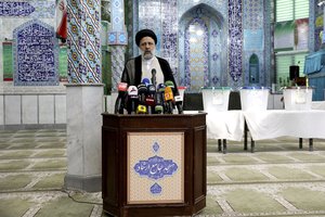 Ebrahim Raisi a candidate in Iran's presidential elections speaks to the media after casting his vote at a polling station in Tehran, Iran, Friday, June 18, 2021