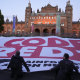 Climate activists unfurl a large “Code Redd” banner outside the climate talks in Glasgow.