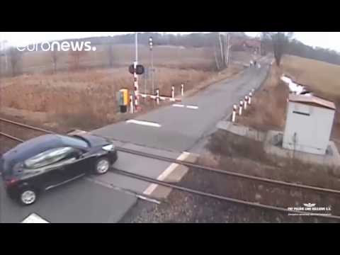 Train ploughs into car at level crossing in Poland