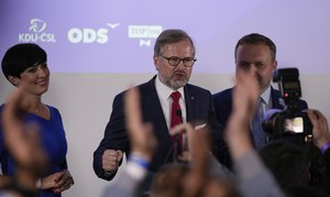 Leader of center-right Spolu (Together) coalition Petr Fiala, centre, addresses to his supporters at the party's election headquarters after the country's parliamentary election, Prague, Czech Republic, Saturday, Oct. 9, 2021.