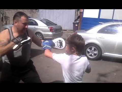 Irish traveller trains young son on boxing pads. Rocky Reilly Jr.