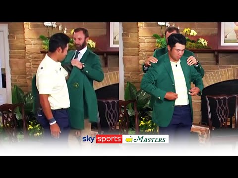 Hideki Matsuyama reacts to winning Masters and is presented with green jacket by Dustin Johnson