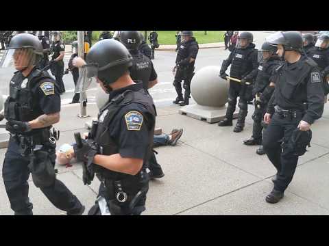 Two Buffalo police officers shove a man to the ground in front of City Hall (WARNING: GRAPHIC)