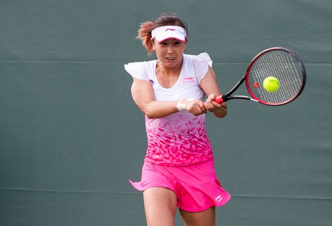 Shuai Peng (CHN) competes against Alison Van Uytvanck (BEL) at the 2016 Miami Open presented by Itau in Key Biscayne, Florida. Photographer Aaron Gilbert