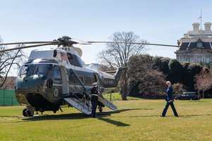 President Joe Biden walks across the South Lawn of the White House Friday, March 26, 2021, before boarding Marine One en route to Joint Base Andrews, Maryland to begin his trip to Delaware.