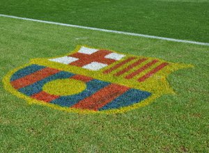 FC Barcelona logo on green grass