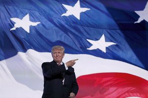 Republican Presidential Candidate Donald Trump, walks out to the stage to greet Republican Vice Presidential Nominee Gov. Mike Pence of Indiana during the third day session of the Republican National Convention in Cleveland, Wednesday, July 20, 2016. (AP Photo/Carolyn Kaster)