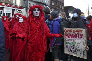 Climate activists from Extinction Rebellion march during a protest organized by the Cop26 Coalition in Glasgow, Scotland, Saturday, Nov. 6, 2021 which is the host city of the COP26 U.N. Climate Summit.