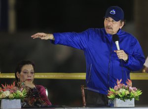 File - Nicaragua’s President Daniel Ortega speaks next to first lady and Vice President Rosario Murillo, left, during the inauguration ceremony of a highway overpass in Managua, Nicaragua, Thursday, March 21, 2019.