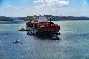 Tugboats bring a container ship from Gatún Lake to the new Agua Clara (Clear Water) Locks at the Atlantic (Caribbean Sea) end of the canal