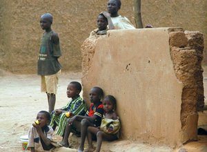  Children watch as U.S. Marines pass out food to the citizens of Tahoua, Niger, March 10, 2006. The Marines are in Niger as part of exercise Shared Accord 2006, an exercise that brings humanitarian aid to Niger, while allowing bilateral ula1 