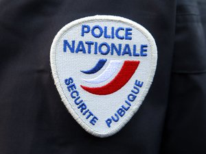 The logo of the French national police is pictured during a ceremony in homage to the police officers killed during the Jan. 7, terrorist attacks in Paris, at the Police School of Cannes-Ecluses, south of Paris, Wednesday March 18, 2015.