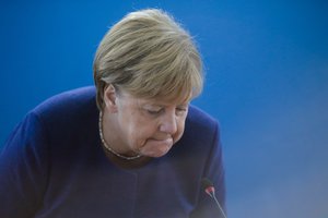 German Chancellor Angela Merkel takes her seat prior to a Christian Democratic Union party's leaders meeting at the party's headquarters a day after the Bavarian state elections, in Berlin, Monday, Oct. 15, 2018.