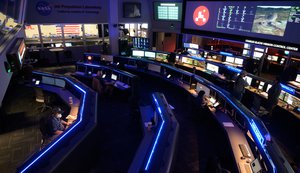 Members of NASA’s Perseverance Mars rover team study data on monitors in mission control, Thursday, Feb. 18, 2021, at NASA's Jet Propulsion Laboratory in Pasadena, California