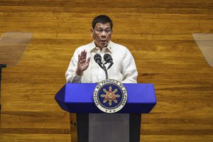 Philippine President Rodrigo Duterte gestures as he delivers his final State of the Nation Address at the House of Representatives in Quezon city, Philippines on Monday, July 26, 2021.