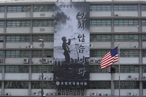 A banner to commemorate the 70th anniversary of the start of the 1950-53 Korean War is displayed after a "Black Lives Matter" banner was taken down at the U.S. Embassy in Seoul, South Korea, Tuesday, June 16, 2020.